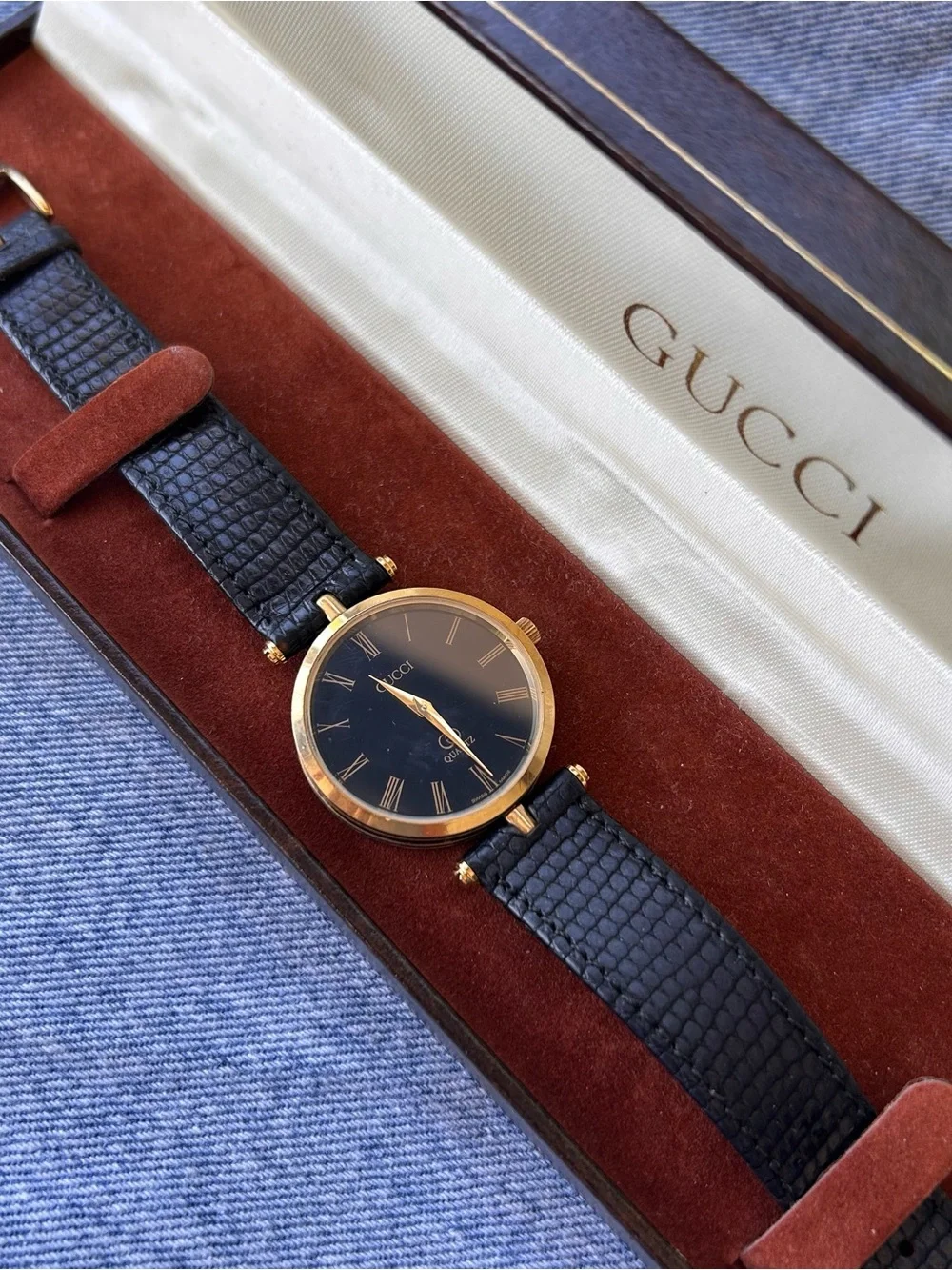 Gucci Black and Gold Round Watch
